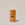 Acure Invisible Sunscreen Stick SPF 50 in a yellow twist-up tube, standing upright on a neutral background.